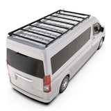 A blackFront Runner Series Toyota HiAce SLWB High Roof (2019-Current) Slimpro Roof Rack Kit mounted on the roof of a silver Toyota van, shown from a high-angle rear view on a white background.