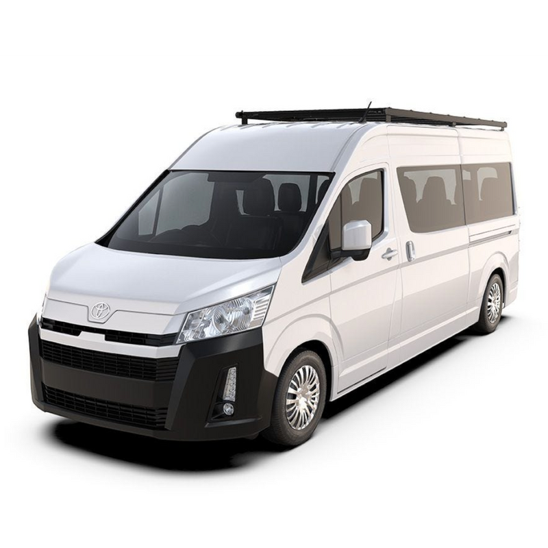 A white Toyota Hiace van with a black Front Runner Series Toyota HiAce SLWB High Roof (2019-Current) Slimpro Roof Rack Kit, shown from a three-quarter front angle on a solid white background.