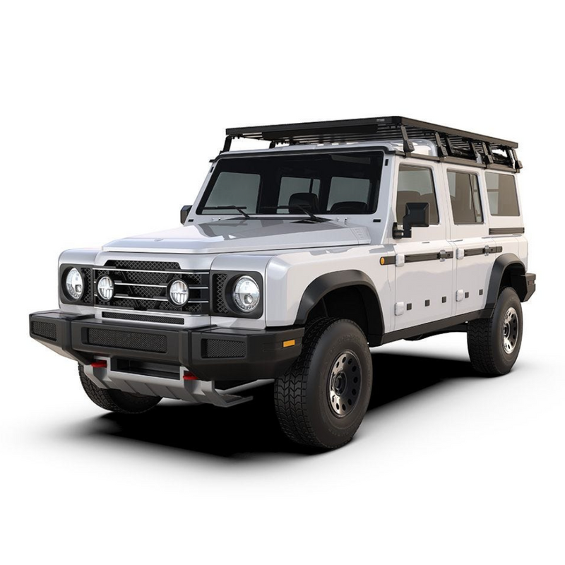 A white off-road SUV with a black Front Runner Ineos Grenadier (2022-Current) Slimline II Roof Rack Kit and black front bumper, photographed on a clean white studio background.
