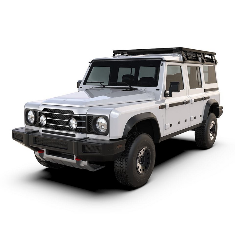 A white off-road SUV with a Front Runner Ineos Grenadier (2022-Current) Slimline II 3/4 Roof Rack Kit, black front bumper, and black trim, shown from a three-quarter front angle on a white background.