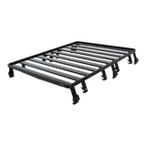 A black Front Runner Ineos Grenadier (2022-Current) Slimline II 3/4 Roof Rack Kit, shown at an angle on a plain white background.