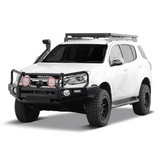 A white Isuzu pickup truck shown from a three-quarter front angle on a clean white background, fitted with a black Front Runner Series Isuzu MU-X (2017-2020) Slimline II Roof Rack Kit, black front bull bar, off-road tires, and auxiliary round lights.