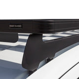 Black Front Runner Series Isuzu MU-X (2021-Current) Slimline II Roof Rack Kit mounted on a white vehicle, featuring a front bumper mount and a black protective front shield. The brand name 'FRONT RUNNER' is visible on the mounting plate.