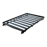 A Front Runner Series Isuzu MU-X (2021-Current) Slimline II Roof Rack Kit with parallel slats and mounting points, shown at an angle on a plain white background.