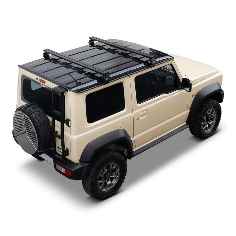A beige Suzuki Jimny SUV with a blackFront Runner Suzuki Jimny (2018-Current) Load Bar Kit and black trim, shown from a three-quarters rear angle on a white background.