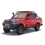 A red pickup truck with a black front bumper, black Front Runner Mahindra Pik-Up Double Cab (2006-Current) Slimline II Roof Rack Kit, and black side steps, shown from a three-quarter angle on a white background.