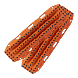 Two orange MAXTRAX XTREME with black tread knobs, shown overlapping on a solid white background.