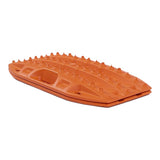 An orange MAXTRAX Mini and Jaxbase Combo with a textured, spiked top surface and a recessed handle cutout, shown on a plain white background.