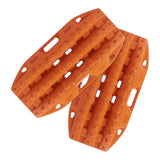 Two orange MAXTRAX Mini and Jaxbase Combo traction boards with textured grip ridges and cutout handles, shown on a plain white background.