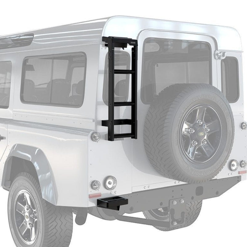 A Front Runner Land Rover Defender 90/110 (1983-2016) Ladder mounted on the rear side of a white off-road vehicle, with a spare tire visible on the back.