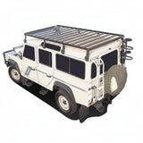 White off-road vehicle with a Front Runner Land Rover Defender 110 (1983-2016) Slimline II Roof Rack Kit / Tall on a white background
