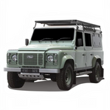Light green Land Rover Defender fitted with the Front Runner Land Rover Defender 110 (1983-2016) Slimline II Roof Rack Kit on a white background