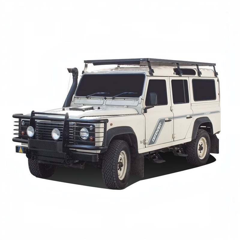 White Land Rover Defender with Front Runner Land Rover Defender 110 (1983-2016) Slimline II Roof Rack Kit / Tall on a white background