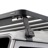 White Land Rover vehicle with a Front Runner Land Rover Defender 90 (1983-2016) Slimline II Roof Rack Kit on a white background