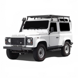 White Land Rover vehicle with a Front Runner Land Rover Defender 90 (1983-2016) Slimline II Roof Rack Kit on a white background