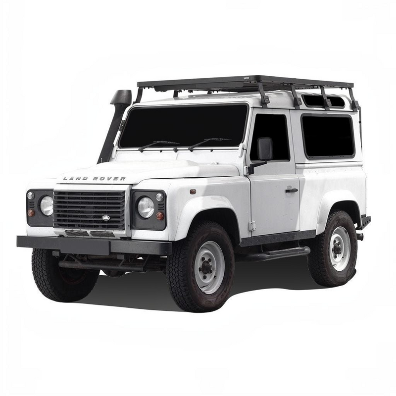 White Land Rover vehicle with a Front Runner Land Rover Defender 90 (1983-2016) Slimline II Roof Rack Kit on a white background
