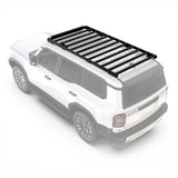 White Toyota SUV with a Front Runner Toyota Land Cruiser Prado 250 (2024-Current) Slimsport Roof Rack Kit / Light Bar Ready on a white 