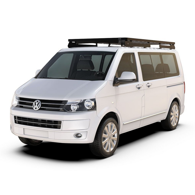 A white Volkswagen Transporter van with a black Front Runner Volkswagen T5 Transporter SWB (2003-2015) Slimline II Roof Rack Kit, shown from a three-quarter front angle on a solid white background.