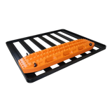 An orange textured traction pad, shown mounted on a black metal rack with Front Runner Series Recovery Device Mounting Kit, against a plain white background.