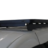 A Front Runner Volkswagen Caddy LWB (2015-2020) Slimline II Roof Rack Kit mounted on the roof of a light gray vehicle, shown against a plain white background. A small 'Front Runner' brand badge is visible on the crossbar.