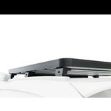 Front Runner Series RSI Double Cab Smart Canopy Slimline II Rack Kit, displayed on a blurred out on a SmartCap Canopy, viewed from the side profile