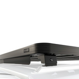 Close up view of the Front Runner Series RSI Double Cab Smart Canopy Slimline II Rack Kit, displayed on a blurred out on a SmartCap Canopy.