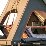 Camping setup with an Alu-Cab Gen3.R rooftop tent fitted with the Backrest accessory. camp 4x4