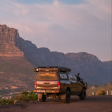 Toyota Hilux with a closed Alu-Cab Gen3.R rooftop tent and 270 Shadow Awning mounted to an Alu-Cab Contour canopy. Camp4x4. camp 4x4, overlanding, camping. Double Cab. Single Cab. Extra Cab 
