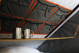 Alu-Cab rooftop tent fitted with the Bamboo interior drop down table, pillows and a speaker. camping 4x4. 
outdoor adventures