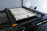 Alu-Cab INEOS Grenadier Table Slide mounted o the roof of the vehicle