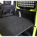 Front Runner Suzuki Jimny 3 Door (2018-Current) Rear Seat Base Deck in a green camp4x4 vehicle