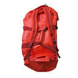A bright red waterproof 120lt MEERKAT Travel bag shown from the back, featuring padded shoulder straps, compression straps with buckles, and a curved bottom seal, isolated on a white background.