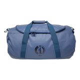 A blue 90 lt MEERKAT Travel Bag / duffel bag with dark blue webbing handles and a circular black logo on the front pocket, shown against a plain white background.
