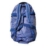 A blue 90 lt MEERKAT Travel Bag / duffel bag / waterproof backpack shown from the back, featuring multiple adjustable straps and buckles, photographed against a solid white background.