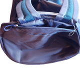 Close-up of a blue 90 lt MEERKAT Travel Bag / duffel bag with a front zippered pocket and light blue-gray shoulder straps, isolated on a white background.