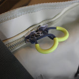 A Cose up view of a beige 65 lt MEERKAT Travel Bag / duffel bag, showing the Rugged Zipper and quality of the material