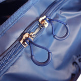 A Cose up view of a blue 90 lt MEERKAT Travel Bag / duffel bag, showing the Rugged Zipper and quality of the material