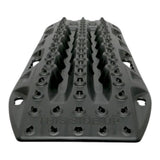 A black MAXTRAX LITE recovery mat with a textured tread pattern and the words 'THIS SIDE UP' embossed on the front, shown on a plain white background.