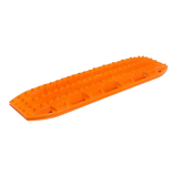 An orange plastic MaxTrax MKII with textured grip ridges, shown on a plain white background.