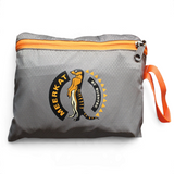 A gray waterproof stuff sack with an orange zipper and orange carrying strap, featuring a 'Meerkat by Bushcrafter' logo on the front.