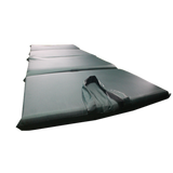 A dark gray MEERKAT Nylon Folding Mattress arranged diagonally on a plain white background.