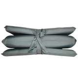 A MEERKAT Nylon Folding Mattress with a matching gray tie strap, shown against a plain white background.