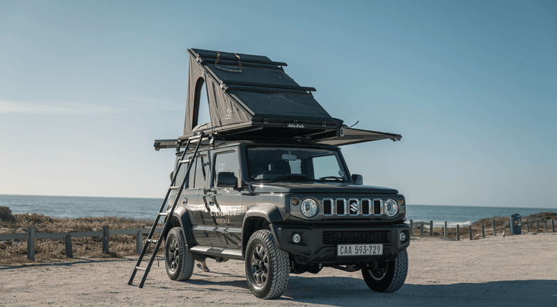 Fully set up dark olive green Suzuki Jimny Camp4x4 available for rent for all your camping needs!