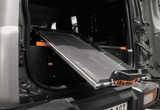 Suzuki Jimny fitted with the Alu-Cab Tilting Fridge Slide, mounted on the Alu-Cab Jimny Draw System