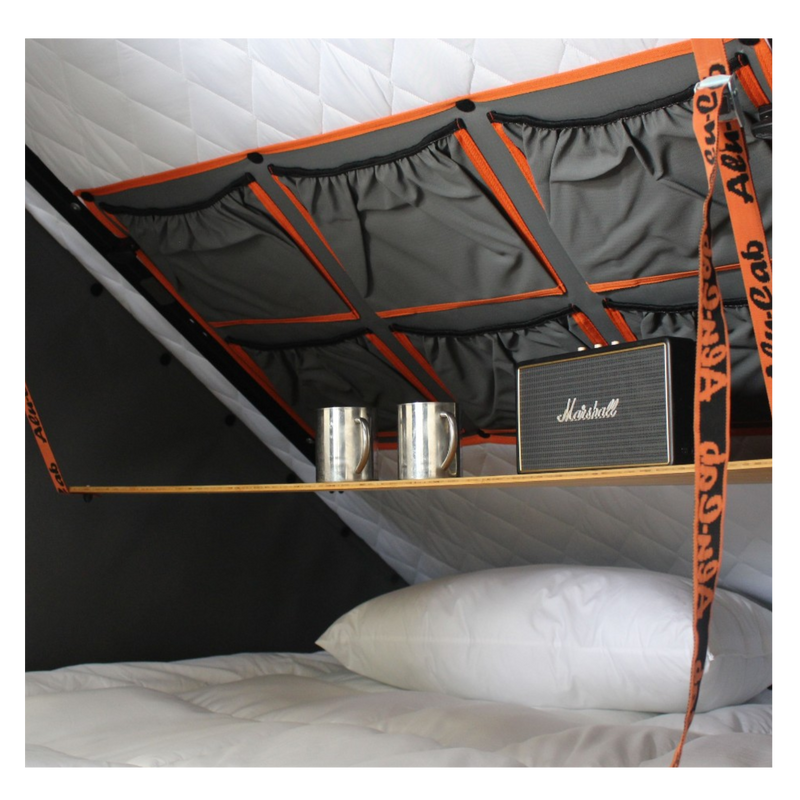 Alu-Cab rooftop tent fitted with the Bamboo interior drop down table, pillows and a speaker. camping 4x4. 
outdoor adventures