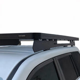 Close up view of a Toyota Prado 150, fitted with a Front Runner Slimline II Roof Rack Kit, on a white background