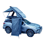 Car with a rooftop tent and a RoofPod Shower/Privacy Cube attached on a white background