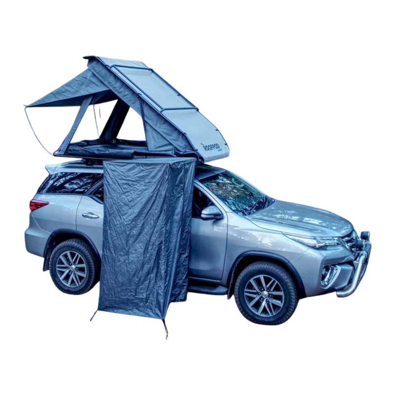 Car with a rooftop tent and a RoofPod Shower/Privacy Cube attached on a white background