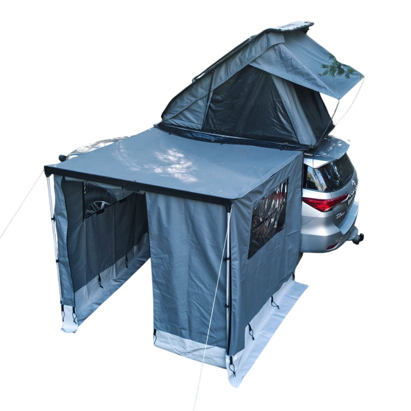 Car with a gray RoofPod rooftop tent and Awning attached on a white background