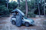 Silver Toyota Fortuner with a RoofPod Roof Pod rooftop tent and Shower Cube and awning. ComfyPod, SoloPod, CozyPod. Camp 4x4, Available at Camp4x4. Overlanding Products and fitments. Camping gear